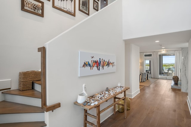 stairway featuring hardwood / wood-style flooring