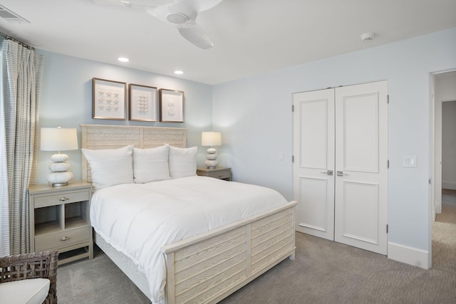 bedroom featuring carpet floors, ceiling fan, and a closet