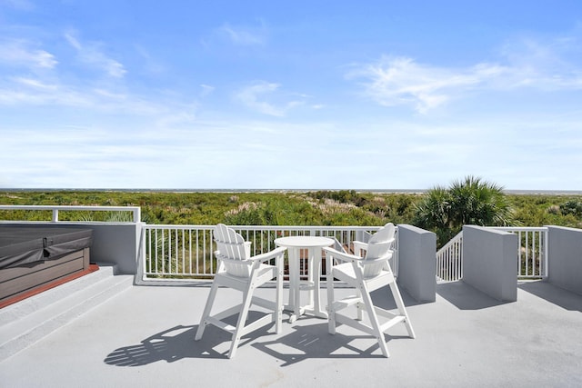 view of patio featuring a balcony