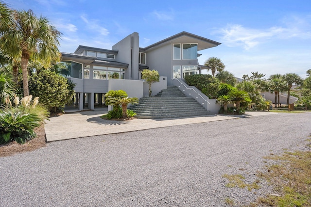 contemporary house featuring a carport