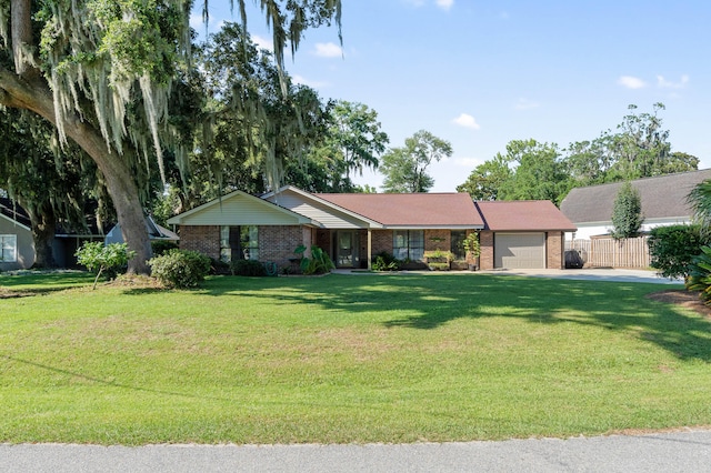 ranch-style home with a front yard and a garage