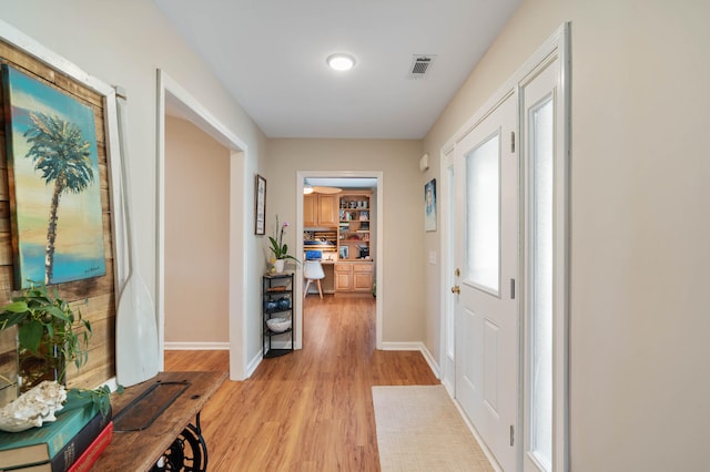 hall featuring light wood-type flooring