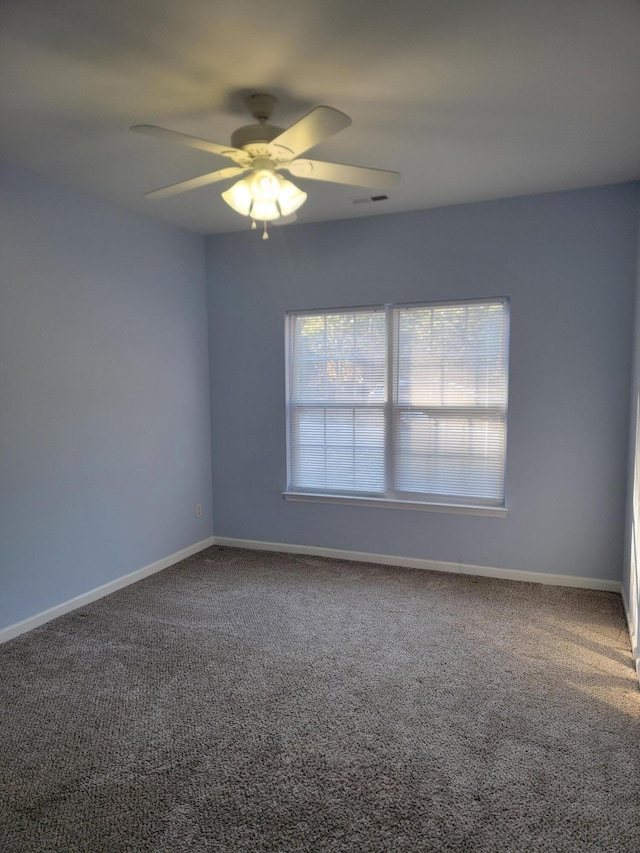 carpeted empty room with ceiling fan