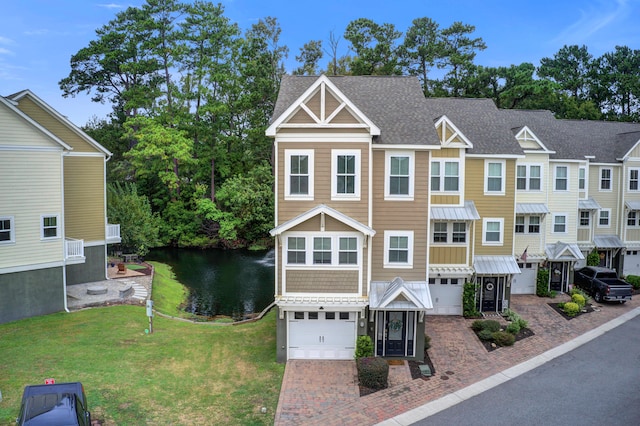 view of front of house with a front yard and a garage