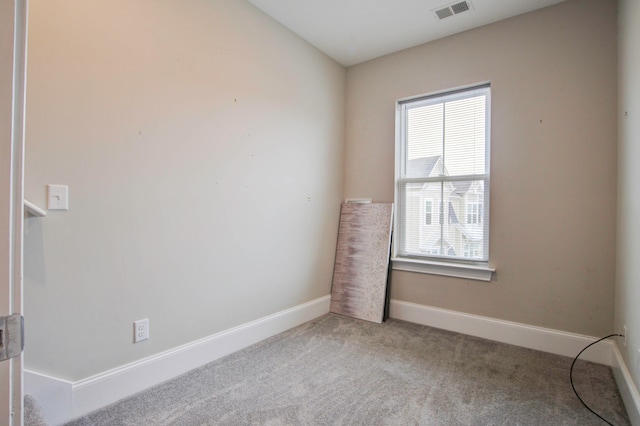 unfurnished room with light carpet