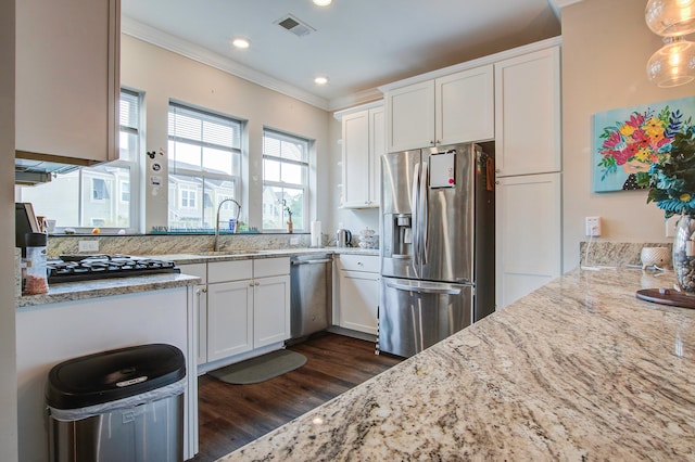 kitchen with sink, decorative light fixtures, white cabinetry, stainless steel appliances, and dark hardwood / wood-style flooring