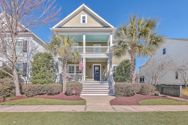 view of front of property with a porch and a balcony