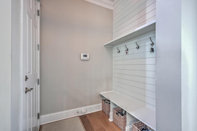 mudroom featuring baseboards and wood finished floors