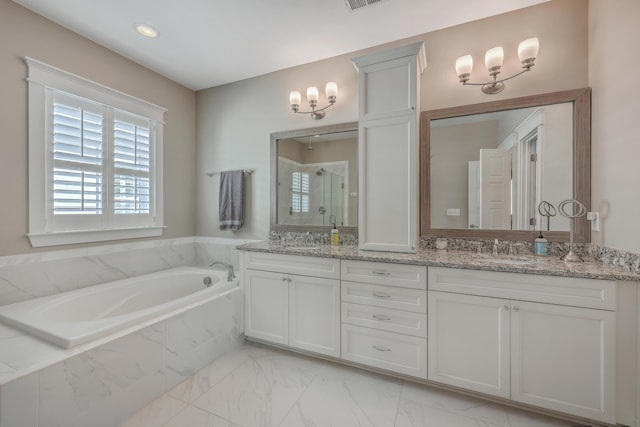 full bath featuring marble finish floor, a garden tub, double vanity, a stall shower, and a sink