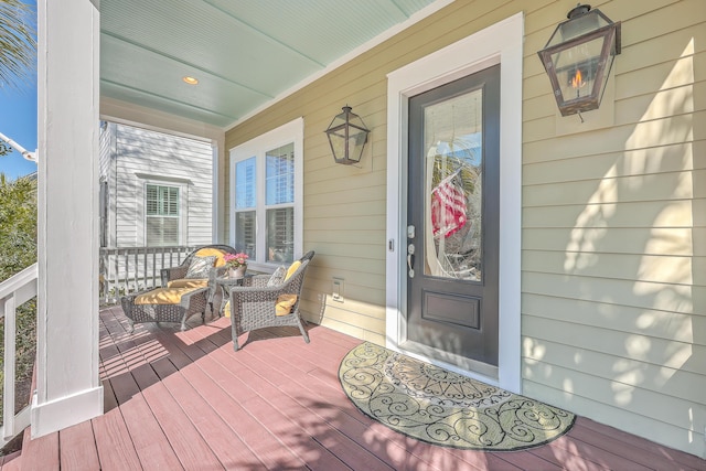 doorway to property featuring covered porch