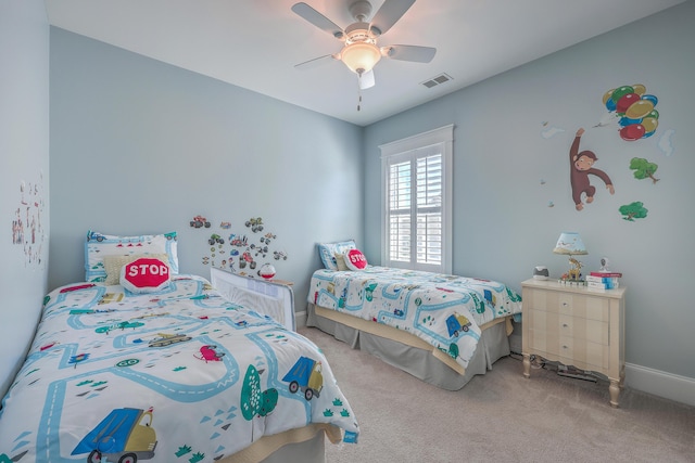 bedroom featuring carpet floors, visible vents, baseboards, and a ceiling fan