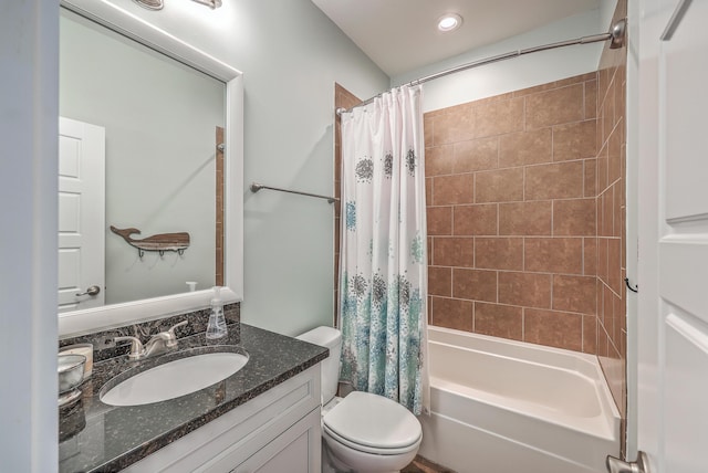 full bathroom featuring vanity, toilet, and shower / tub combo with curtain