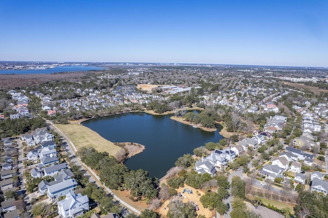 drone / aerial view with a residential view and a water view