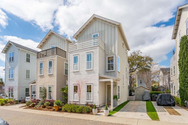137 Bratton Cir, Mount Pleasant, SC 29464 - view of front of home with board and batten siding, driveway, and a balcony