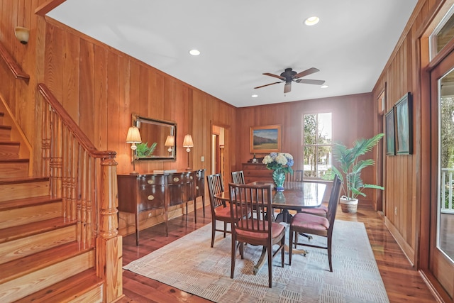 dining space featuring stairs, wood finished floors, and recessed lighting