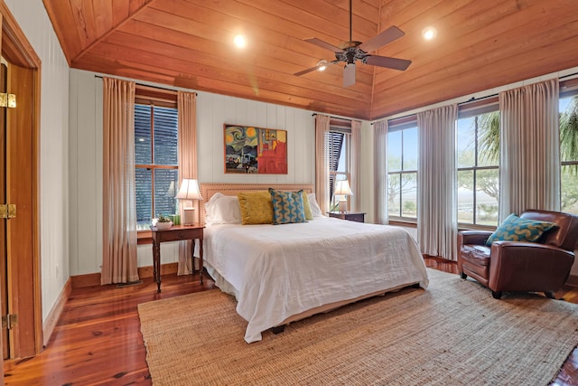 bedroom featuring wood ceiling, baseboards, vaulted ceiling, and wood finished floors