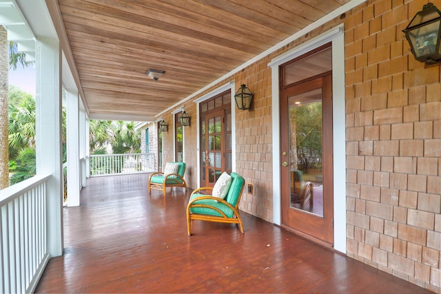 wooden terrace featuring a porch