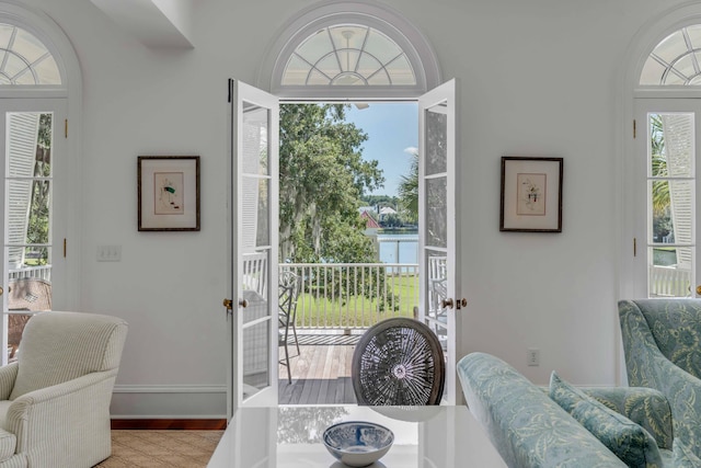 doorway featuring a water view and a wealth of natural light