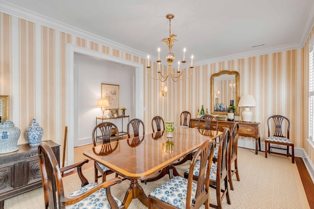 dining area featuring ornamental molding and a notable chandelier