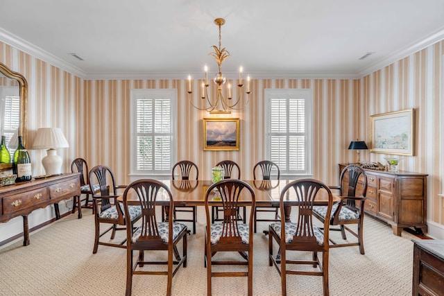 dining room featuring a notable chandelier and crown molding