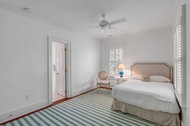 bedroom featuring crown molding, a ceiling fan, and baseboards