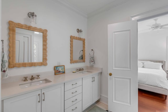 full bath featuring ornamental molding, double vanity, a sink, and a ceiling fan