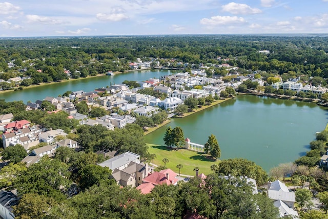 aerial view featuring a water view, a residential view, and a view of trees