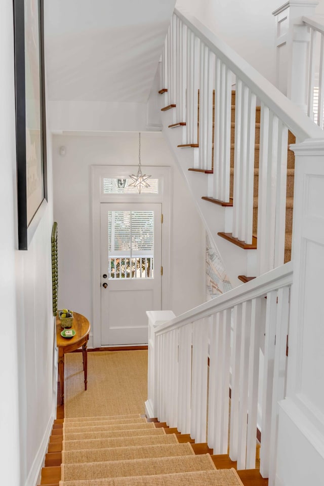 stairway with hardwood / wood-style flooring