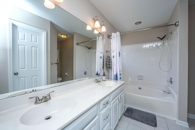 bathroom featuring toilet, shower / bath combination with curtain, tile patterned flooring, and a sink