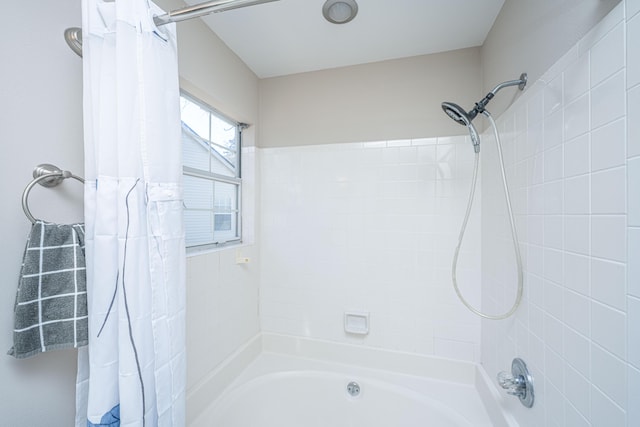 full bathroom with shower / tub combo