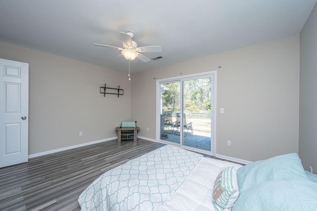 bedroom featuring visible vents, ceiling fan, wood finished floors, access to outside, and baseboards