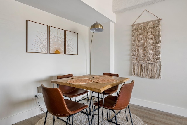 14 Lockwood Dr Unit 1C, Charleston, SC 29401 - dining area with wood finished floors and baseboards