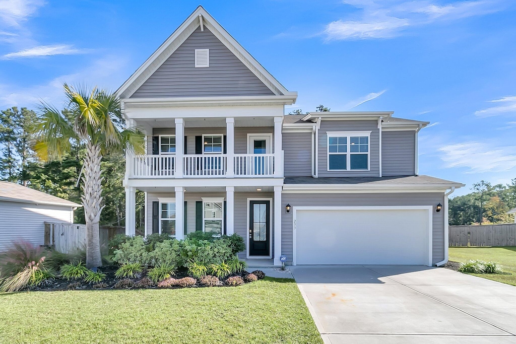 view of front facade with a front yard and a garage