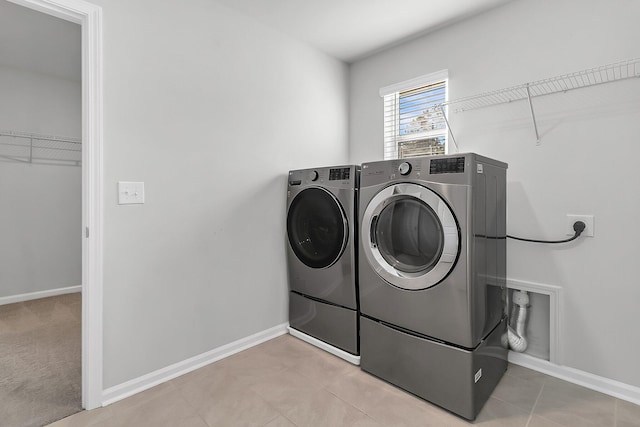 washroom with washer and clothes dryer