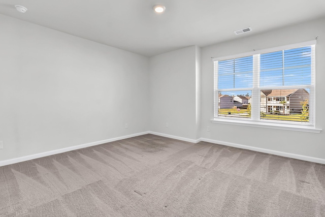 unfurnished room featuring carpet floors