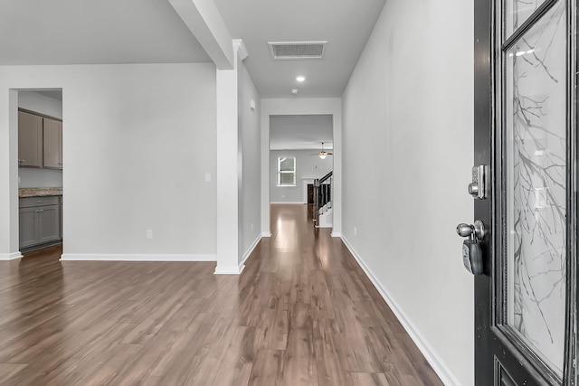 foyer featuring ceiling fan and dark hardwood / wood-style floors