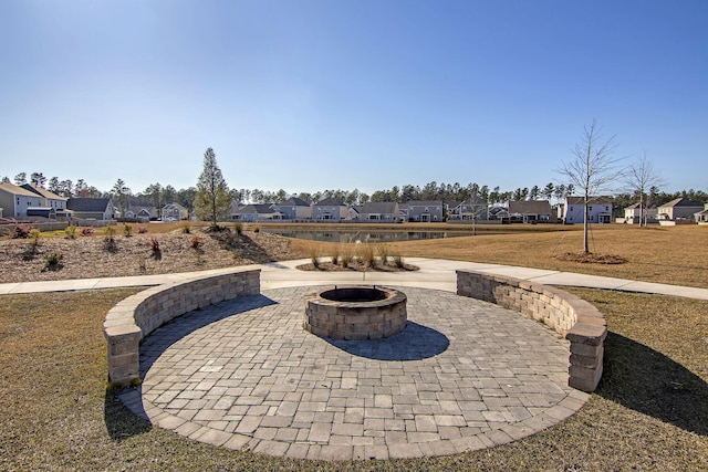 view of patio / terrace featuring an outdoor fire pit