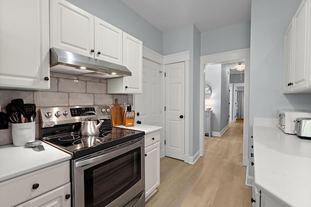 1179 Holly Bend Dr, Mount Pleasant, SC 29466 - kitchen featuring stainless steel electric range, under cabinet range hood, and light countertops