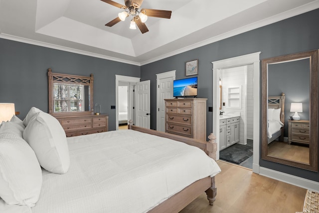 1179 Holly Bend Dr, Mount Pleasant, SC 29466 - bedroom with a tray ceiling, light wood finished floors, ceiling fan, and ensuite bathroom