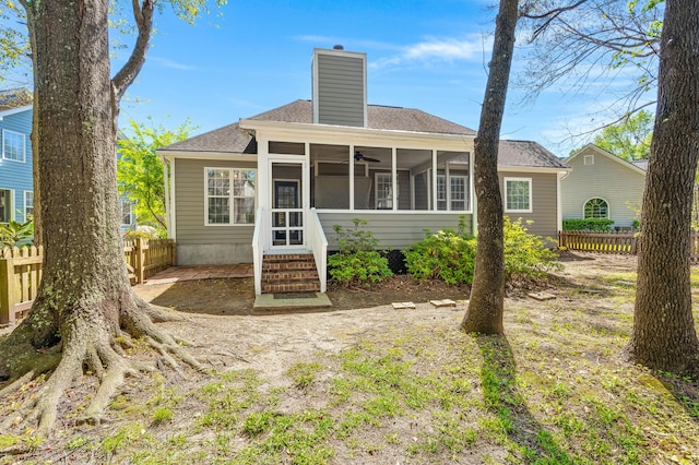 1179 Holly Bend Dr, Mount Pleasant, SC 29466 - back of property with a sunroom, ceiling fan, a chimney, and roof with shingles