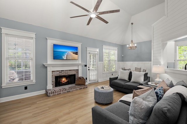 1179 Holly Bend Dr, Mount Pleasant, SC 29466 - living area featuring ceiling fan, a chandelier, light wood-style flooring, a brick fireplace, and high vaulted ceiling