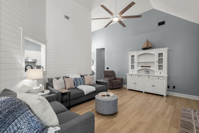 1179 Holly Bend Dr, Mount Pleasant, SC 29466 - living area with high vaulted ceiling, a ceiling fan, light wood-style floors, and baseboards