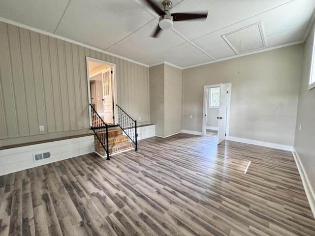 spare room featuring hardwood / wood-style floors, ornamental molding, and ceiling fan