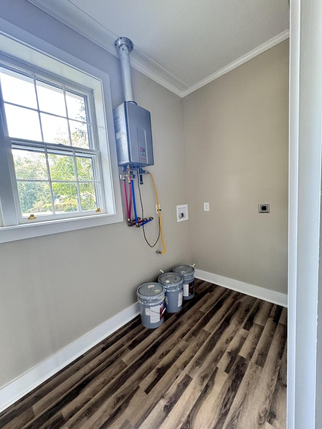 clothes washing area featuring water heater, ornamental molding, electric dryer hookup, and dark wood-type flooring