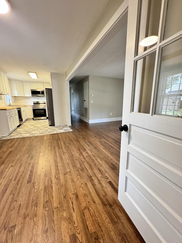 unfurnished living room featuring light hardwood / wood-style flooring