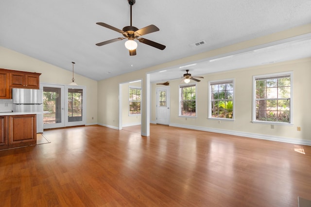 4162 Murrells Inlet Rd, Murrells Inlet, SC 29576 - unfurnished living room with a ceiling fan, wood finished floors, lofted ceiling, and baseboards