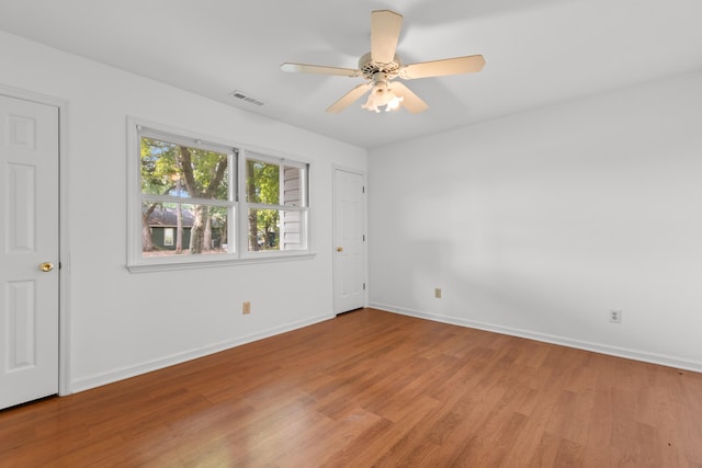 4162 Murrells Inlet Rd, Murrells Inlet, SC 29576 - unfurnished bedroom with light wood finished floors, baseboards, and ceiling fan
