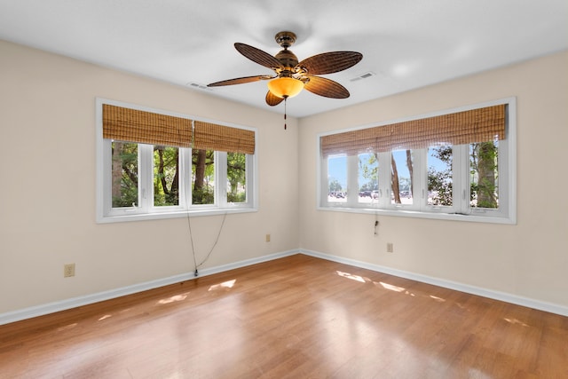 4162 Murrells Inlet Rd, Murrells Inlet, SC 29576 - empty room featuring wood finished floors, baseboards, and a ceiling fan