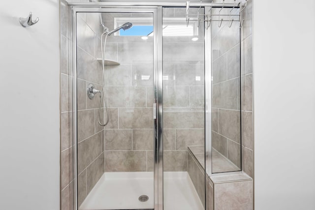 full bathroom featuring a shower stall