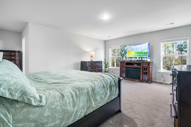 bedroom featuring carpet, visible vents, and baseboards